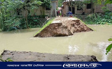 আত্রাই নদীর বেড়িবাঁধ ভেঙে নিম্নাঞ্চল প্লাবিত